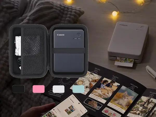 Canon Selphy QX20 sticker print samples on table
