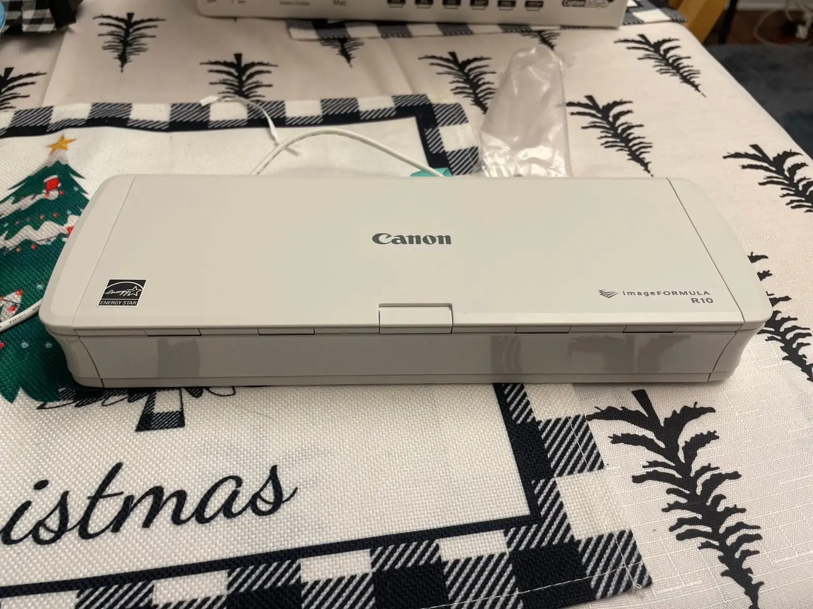 Canon R10 portable document scanner front view