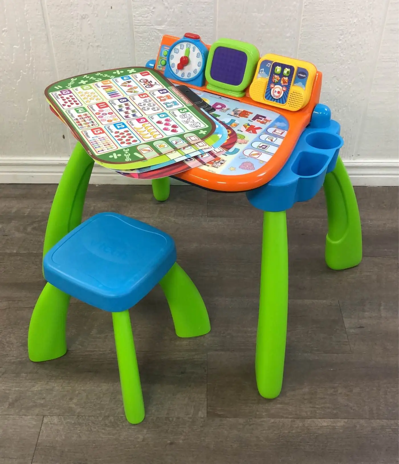 VTech Touch and Learn Activity Desk Deluxe expansion packs on table