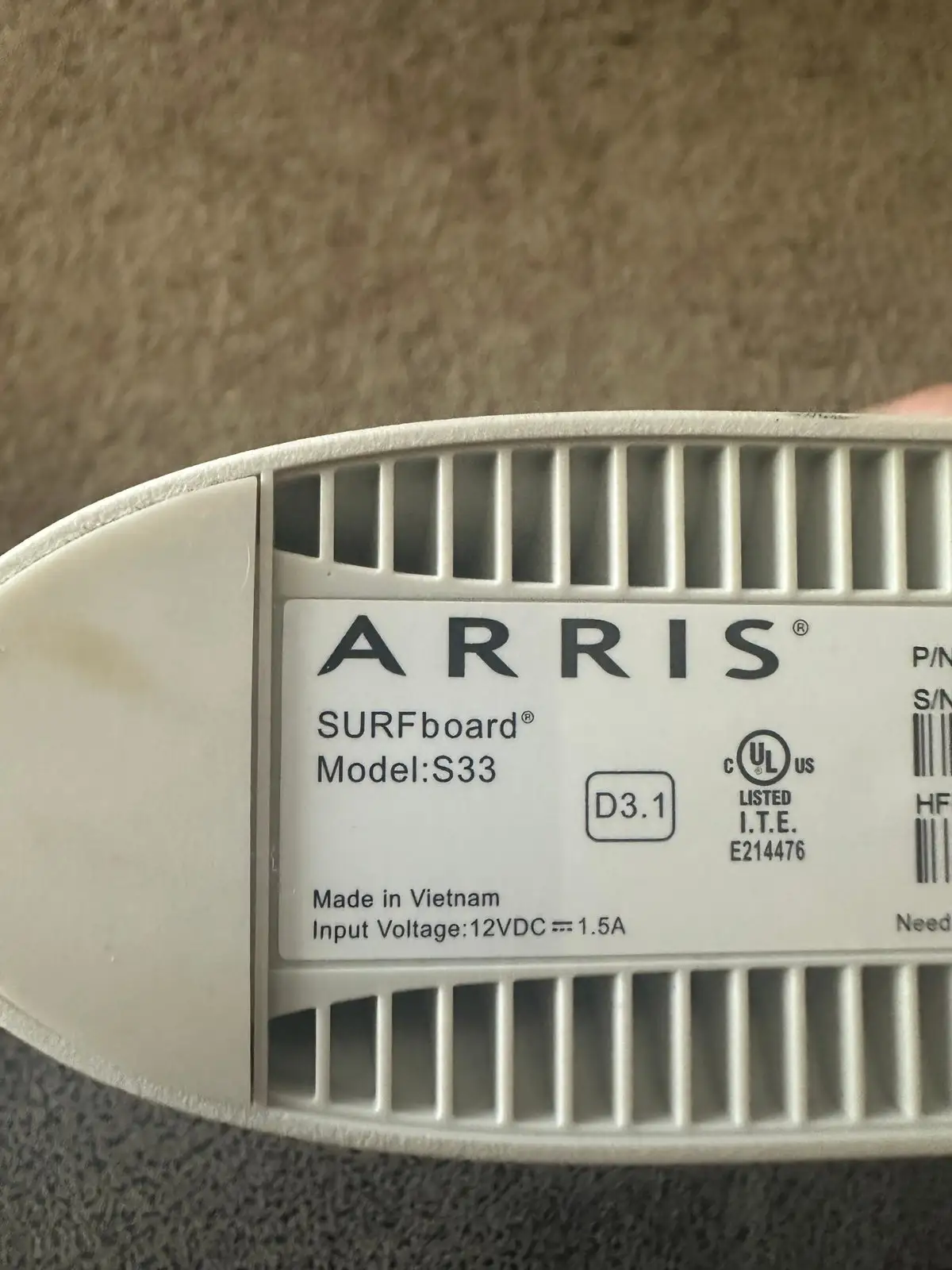 ARRIS S33 cable modem front and side view