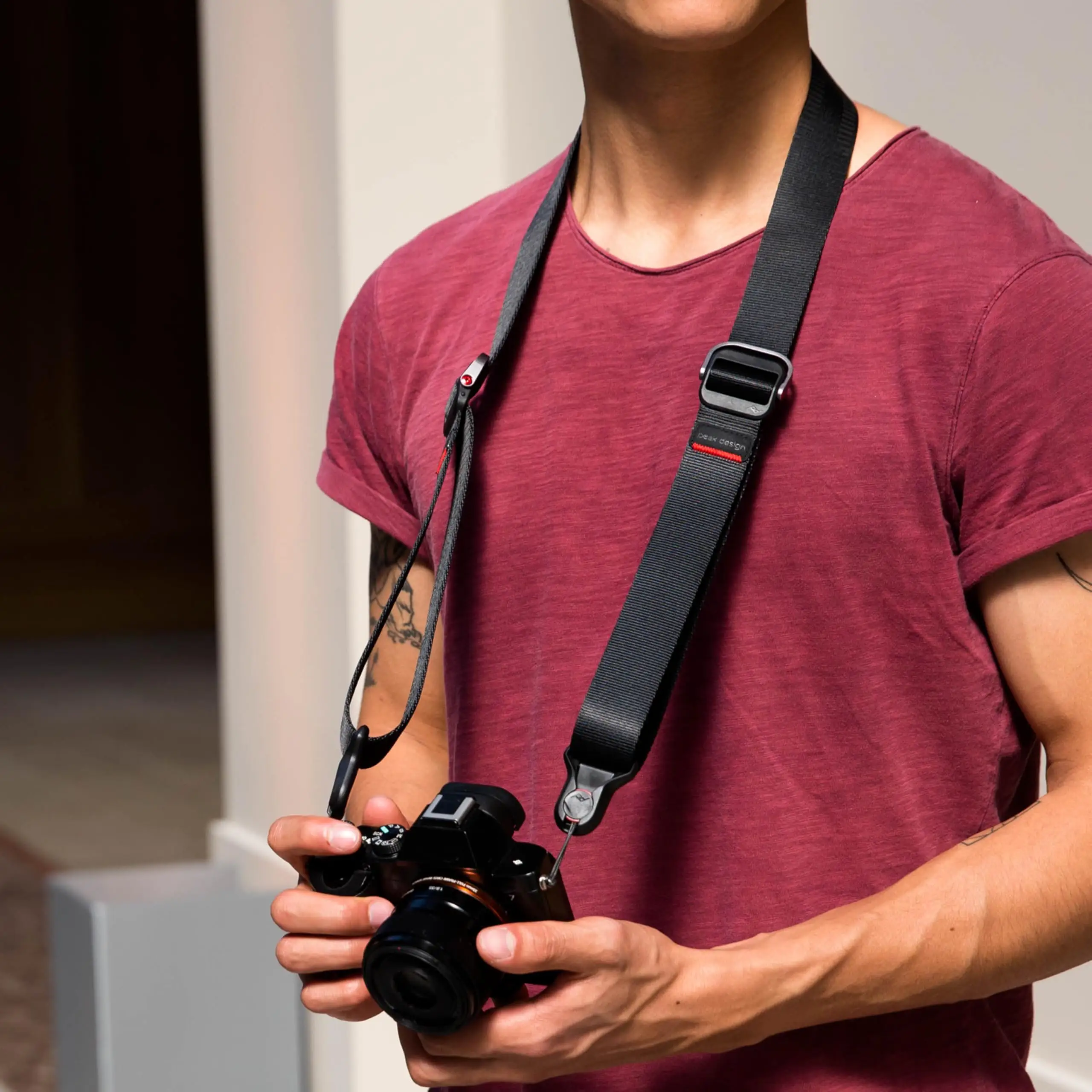 Peak Design Slide Lite camera strap on table