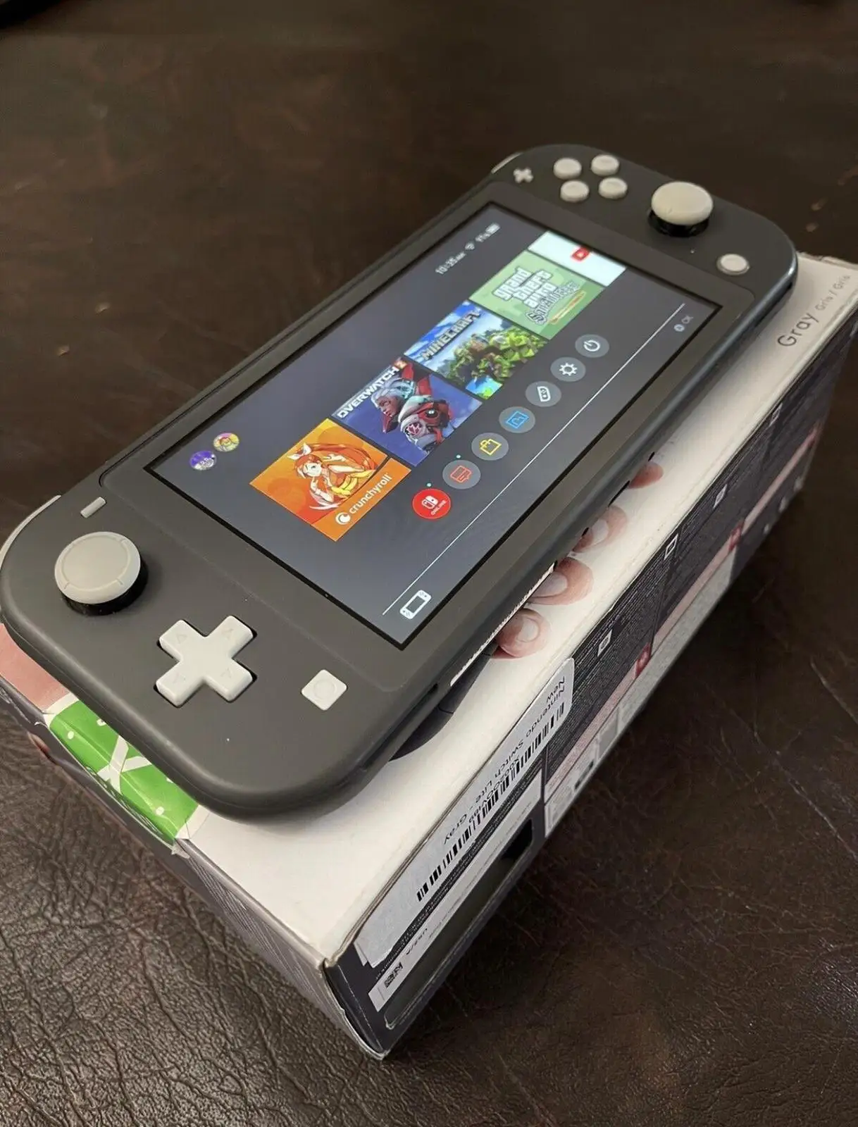 Nintendo Switch Lite Gray highlighting screen size and docking limits