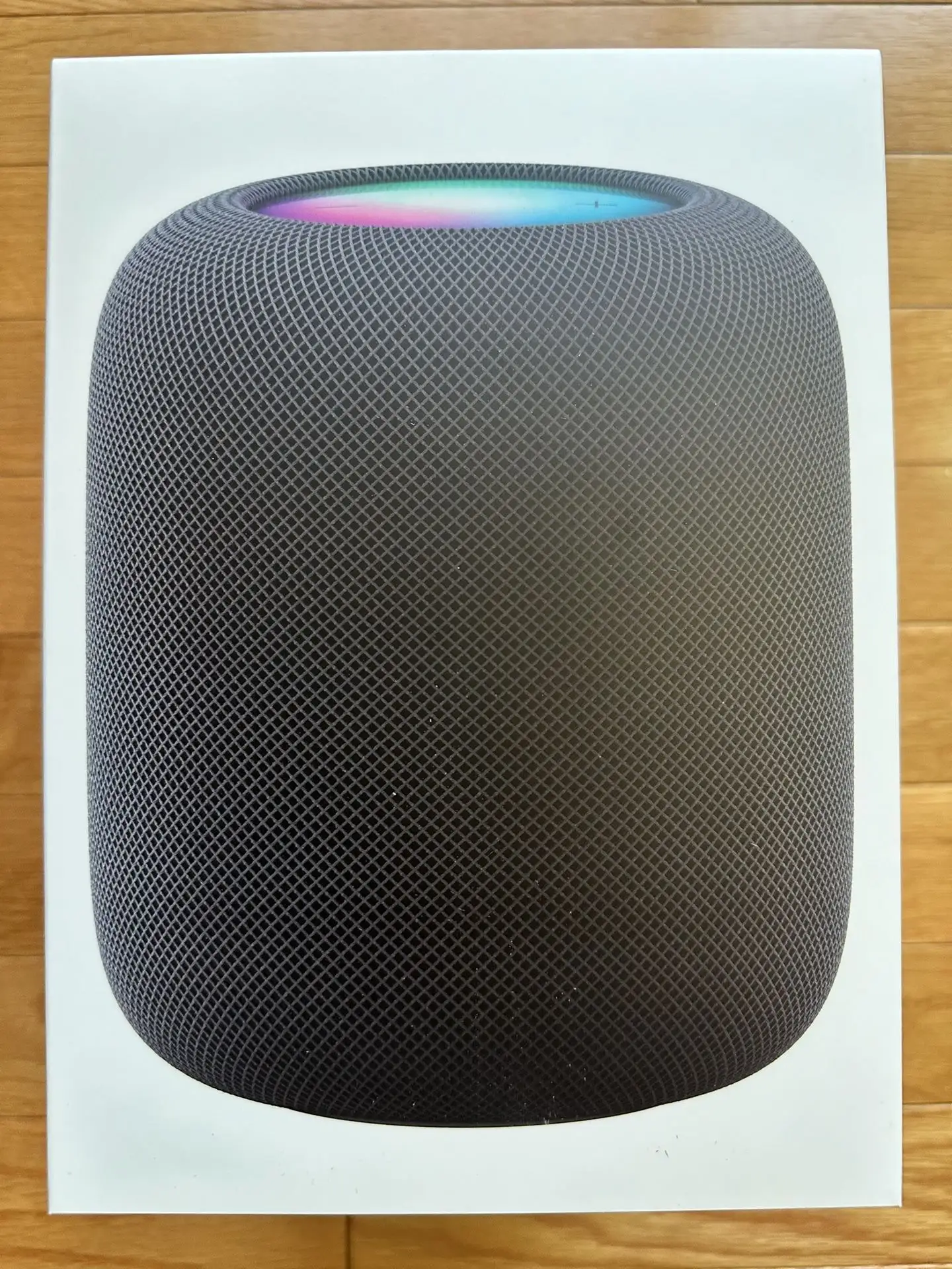 Apple HomePod 2nd Gen product shot showing size comparison