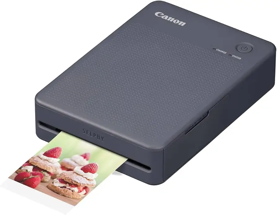 Canon SELPHY QX20 retail bundle showing printer and supplies