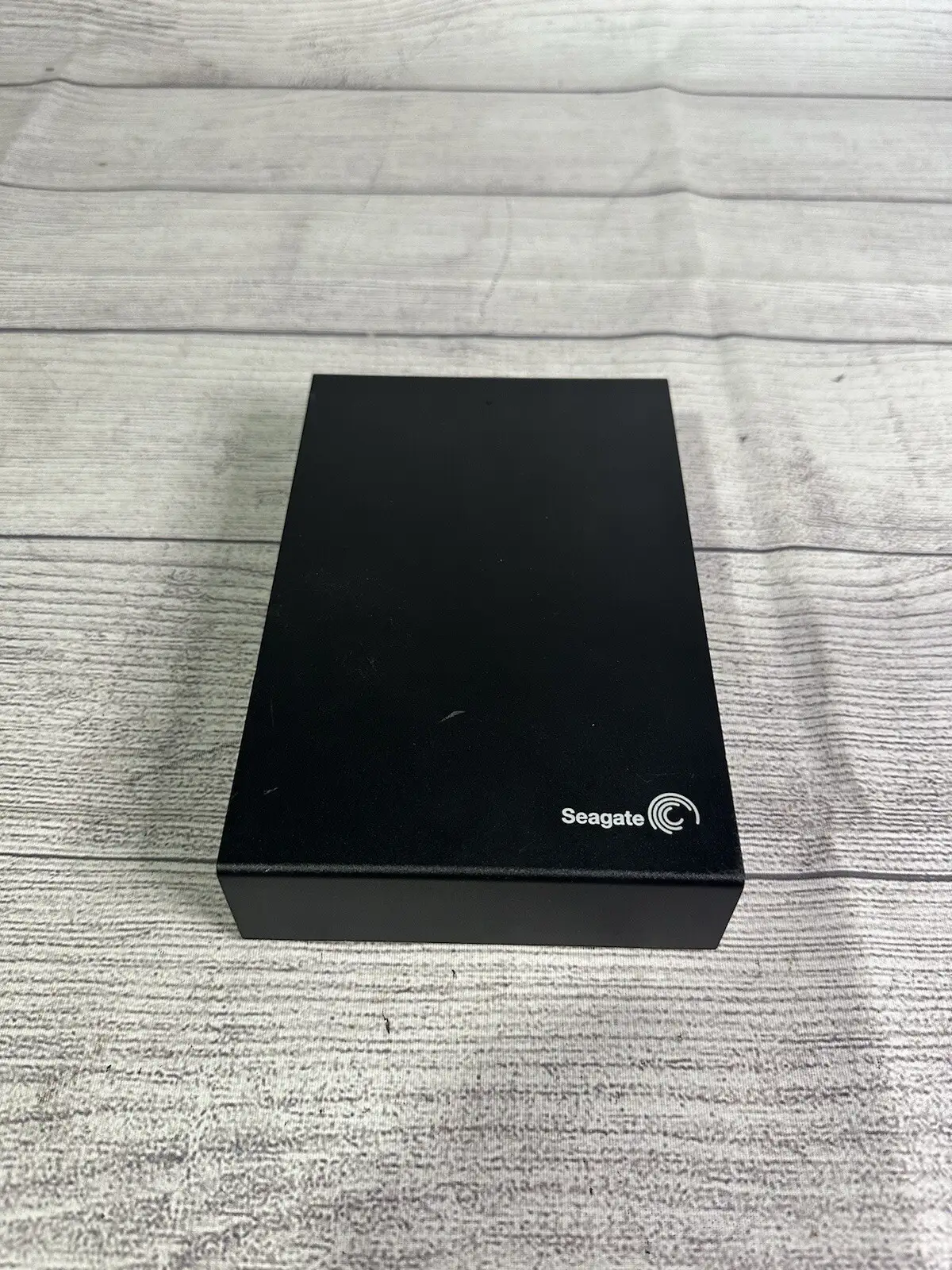 Seagate Portable 2TB in travel setup with laptop